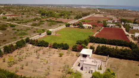 drone panorama of mediterranean sea coast and countryside in puglia, italy