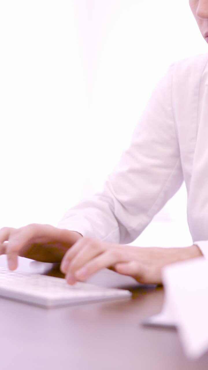 Unrecognizable healthcare worker team working in desk in a clinic