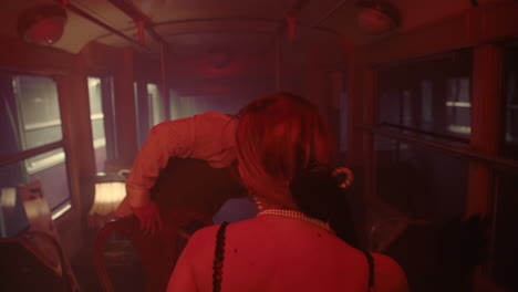 couple on a vintage tram at night