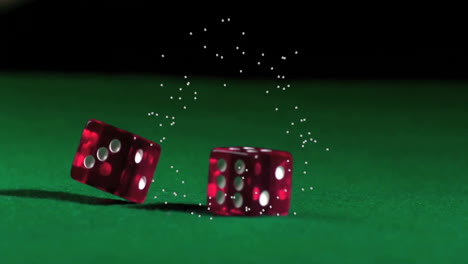 rolling dice with sparkling particles animation over green surface