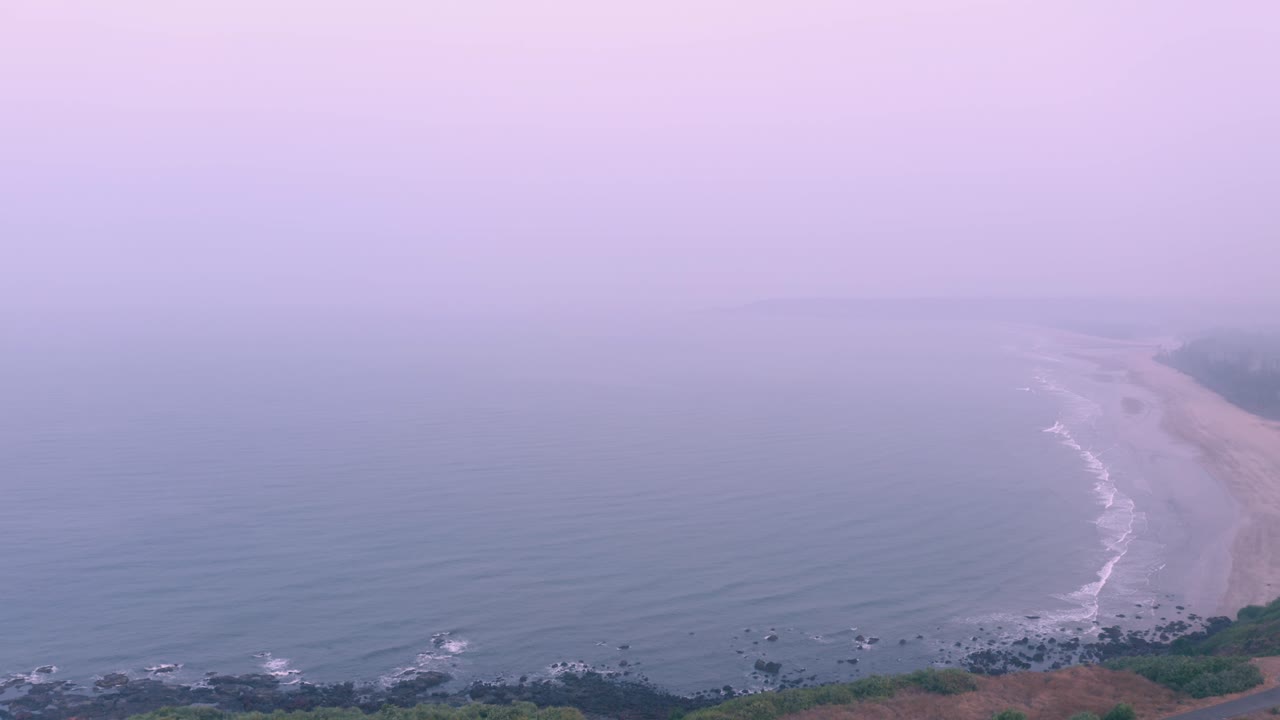 Aerial view revealing sea and beach