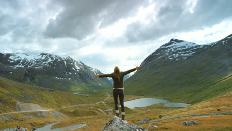 woman enjoying the view from a mountain summit