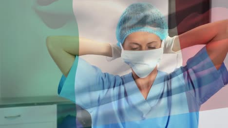 animación de la bandera de italia ondeando sobre una cirujana en el quirófano