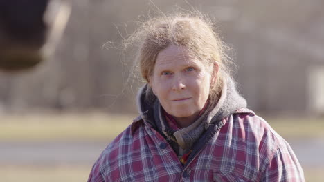 woman hopes for horse to interact with her during equine experiential learning