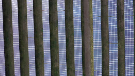 aerial view of giant solar field in desert shot from above looking down creating clean energy