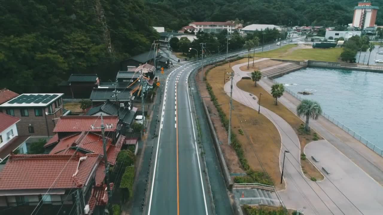 Aerial view of a coastal town with a road