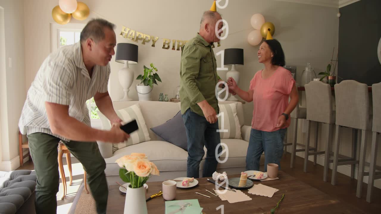 Three adults on couch eating cake, center man adjusting hat, technology overlay growing, leaving