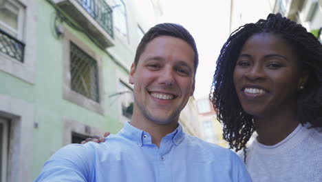 Happy-young-couple-looking-at-camera.