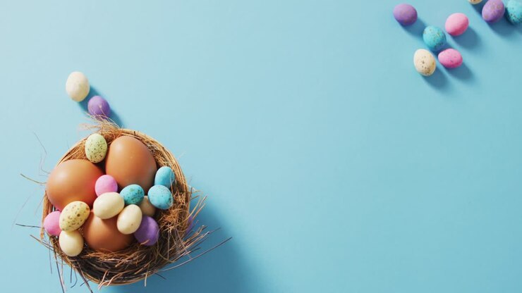 Video of decorated colorful easter eggs on a blue surface