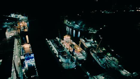 Illuminated-Shipyard-In-Rijeka,-Croatia-At-Night---Inspire-2-Drone-Shot