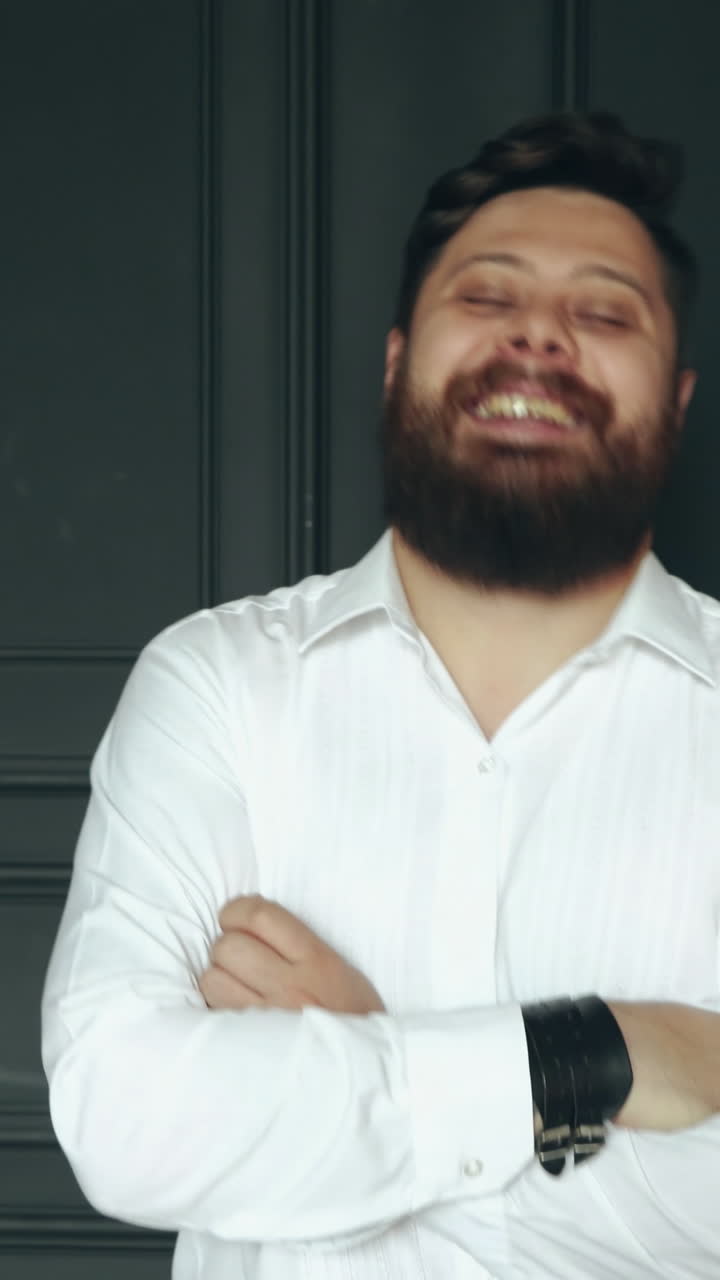 Gentleman posing in studio. Portrait of stylish handsome man with beard in studio