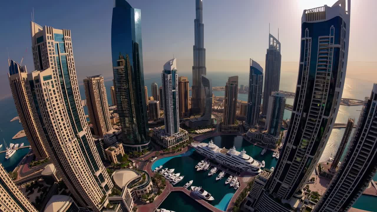 Aerial view of futuristic skyscrapers against a sunset, showcasing modern architecture