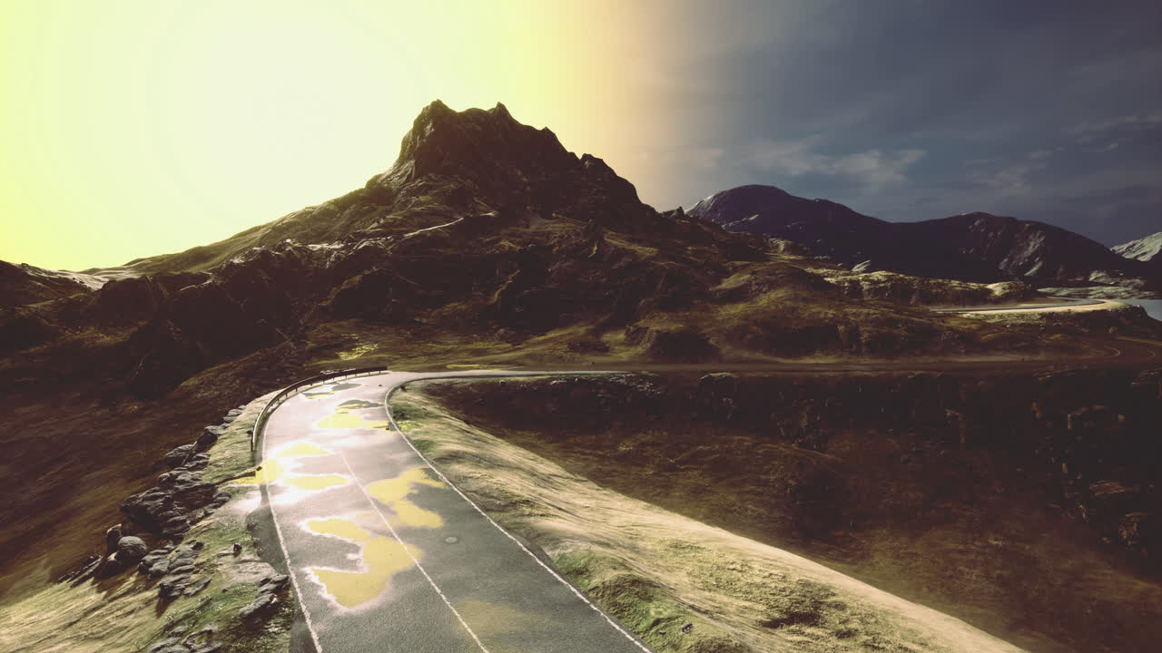Majestic mountain road under a brilliant sunset illuminating the landscape