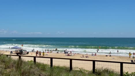 people enjoying the beach and ocean waves