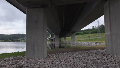 Flying-Under-Farrisbrua-Bridge-In-Larvik,-Norway---drone-shot