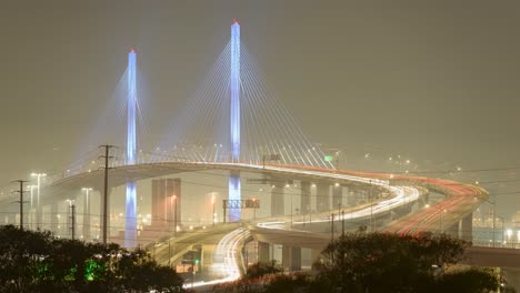 a nighttime timelapse of long beach international gateway bridge with moving lights