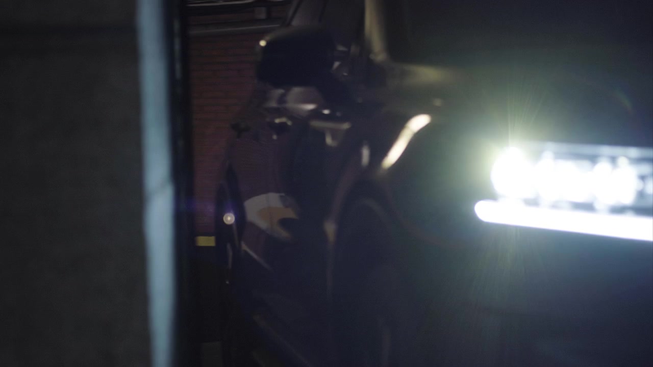 Car comes from a garage and create beautiful flare on the lense
