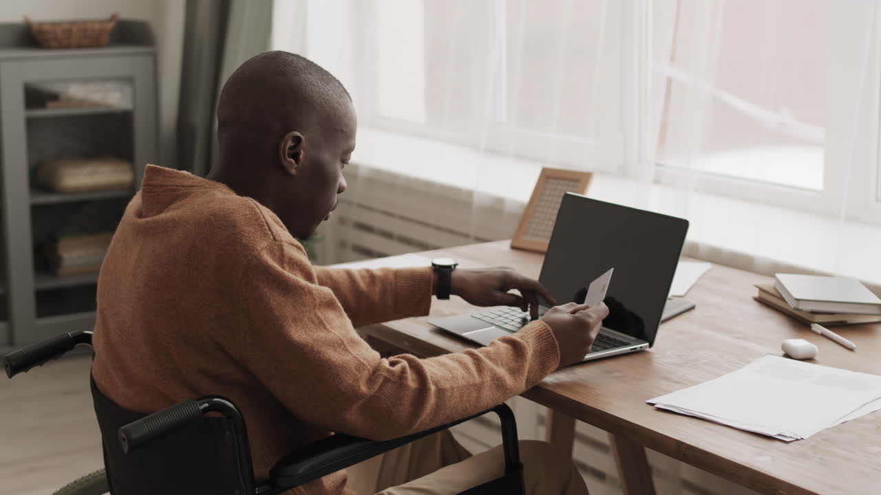 African-American Disabled Man Shopping Online