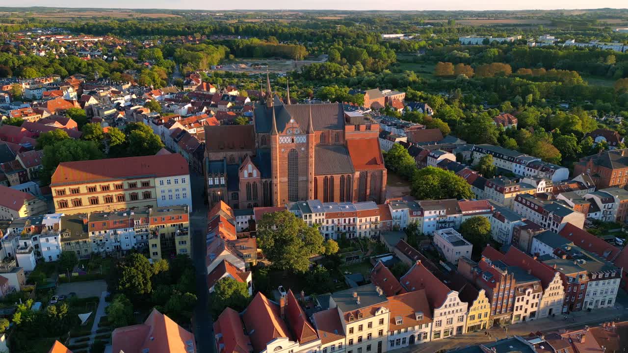 Huge red brick church with large windows