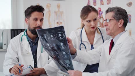 Handheld-view-of-doctors-examining-the-medical-record