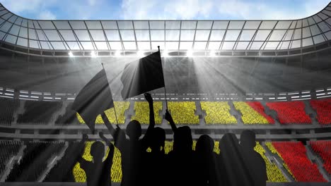 Animation-of-silhouettes-of-sports-fans-cheering-with-belgian-flag-over-sports-stadium