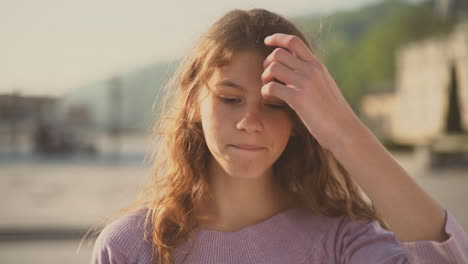 cute teenager girl looks directly into the camera