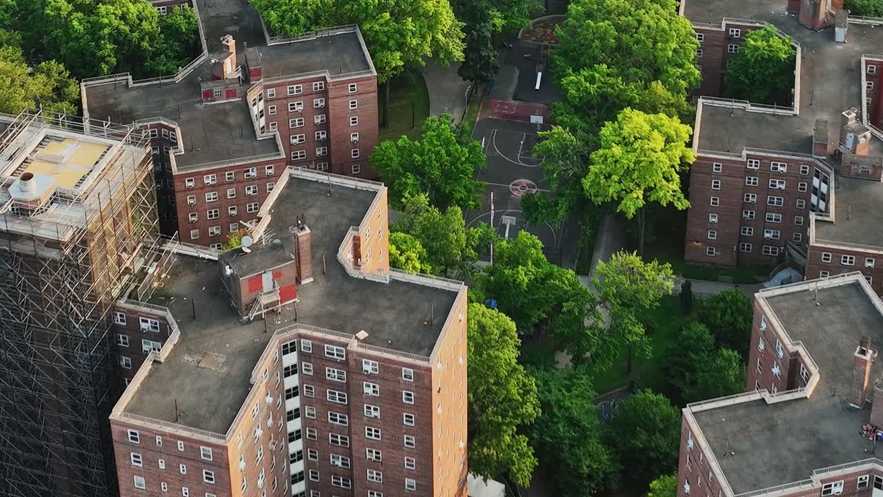 New York City residential buildings surrounded by green parks from above