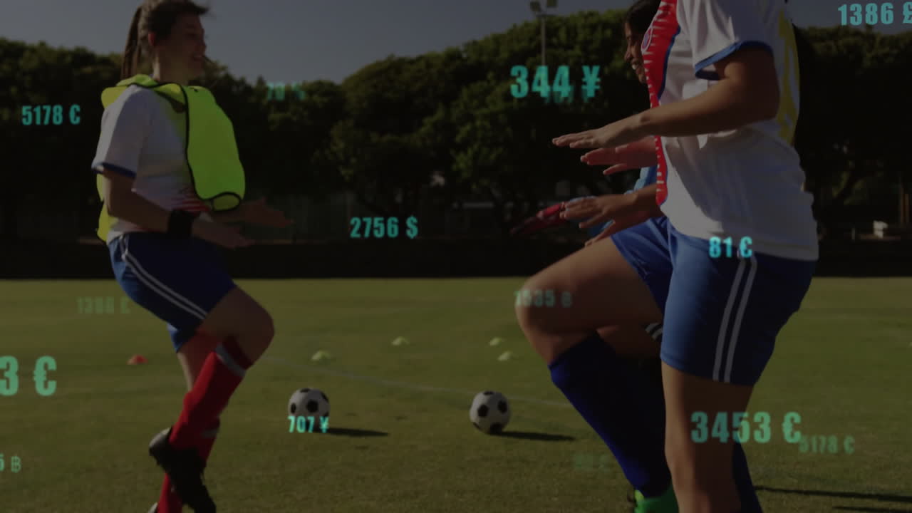 On field, soccer players practicing with animation of currency symbols overlaying