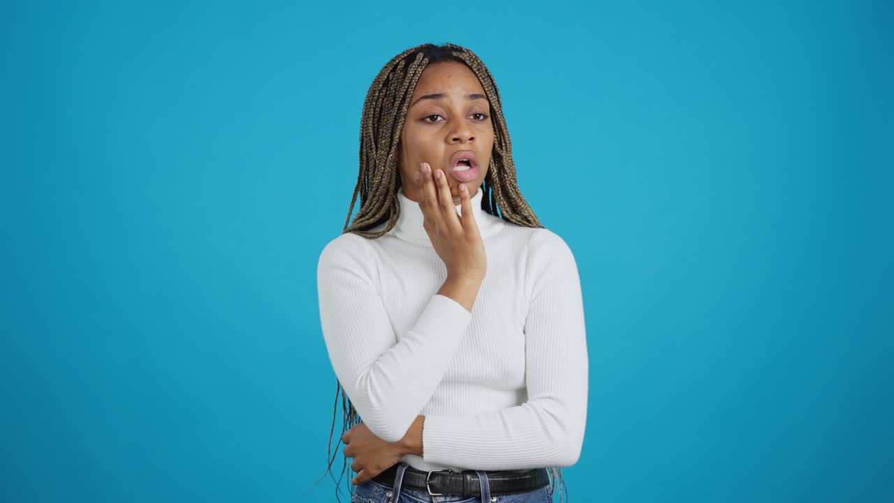 Young Woman Reacting with Surprise and Distress