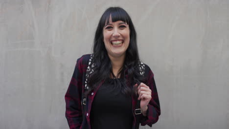 portrait-happy-young-caucasian-woman-laughing-cheerful-looking-at-camera-wearing-nose-ring-stylish-independent-female-slow-motion