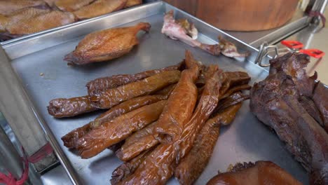 darken intestines cooked in soy sauce at cultural asian street food market for sale in thailand