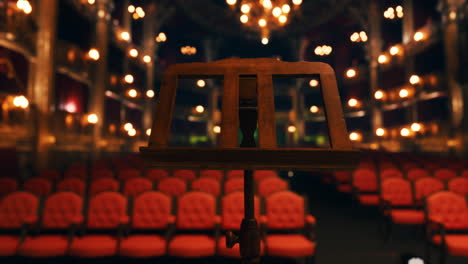 empty stage with music stand in a theater