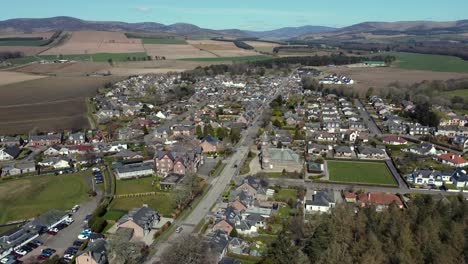 Aerial-view-of-the-Scottish-town-of-Edzell-on-a-sunny-spring-day,-Angus,-Scotland