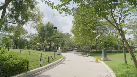 Calm-dynamic-shot-of-a-park-path-in-Hong-Kong,-Asia