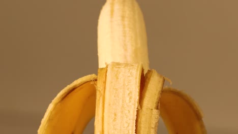 Slowly-moving-shot-of-banana-with-the-peel-half-of