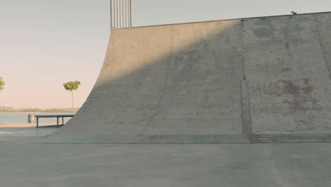 Young-Skater-Girl-Doing-Tricks-On-A-Ramp-In-A-Skate-Park-1