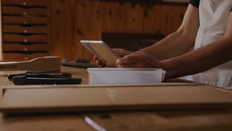 female luthier at work in her workshop