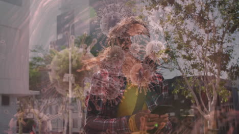 animation of covid 19 cells moving over woman in face mask