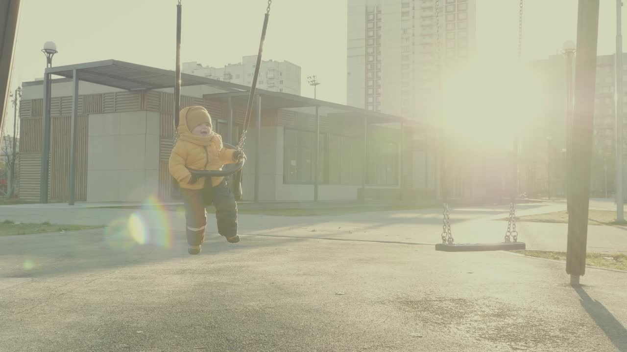 Child on a swing in a playground