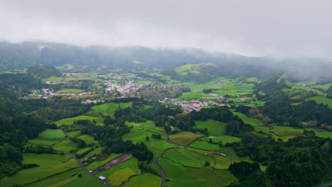 misty green slopes landscape aerial view. countryside at foggy hills environment