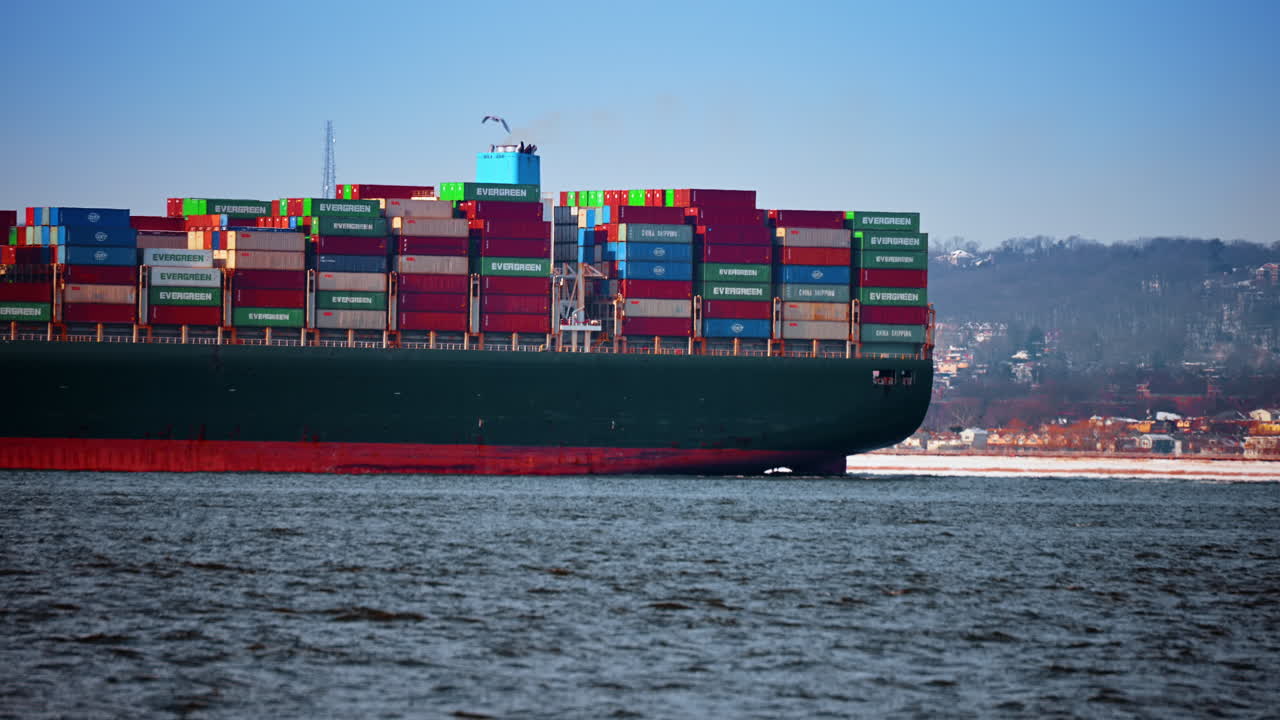New York, USA, 25 December 2025: Stacked containers on cargo ship. Colorful shipping containers fill the deck of a cargo vessel in New York Harbor