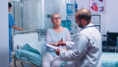 senior retired woman signing for medical release