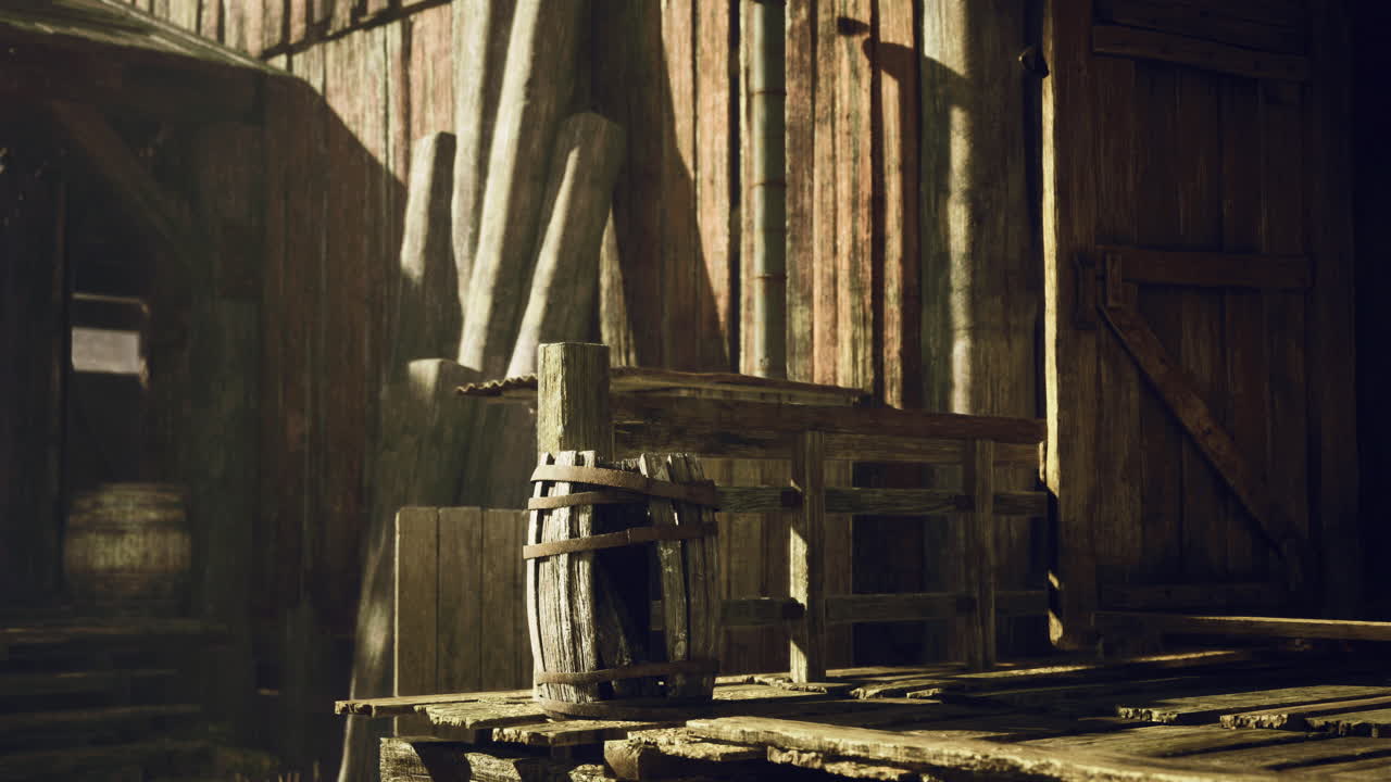 Weathered wooden structures in a rustic barn illuminated by sunlight