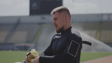 disabled athlete hydrating at stadium