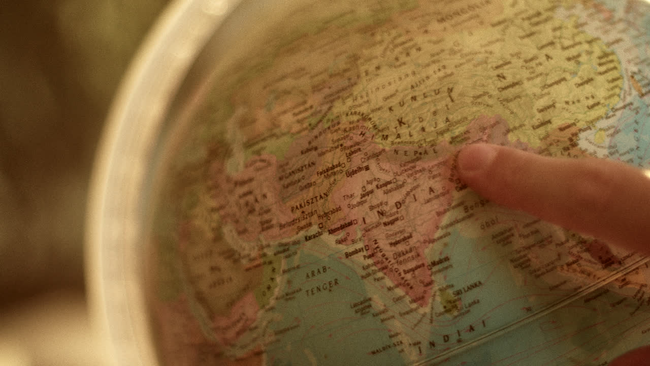Exploring the World: A Finger on the Globe