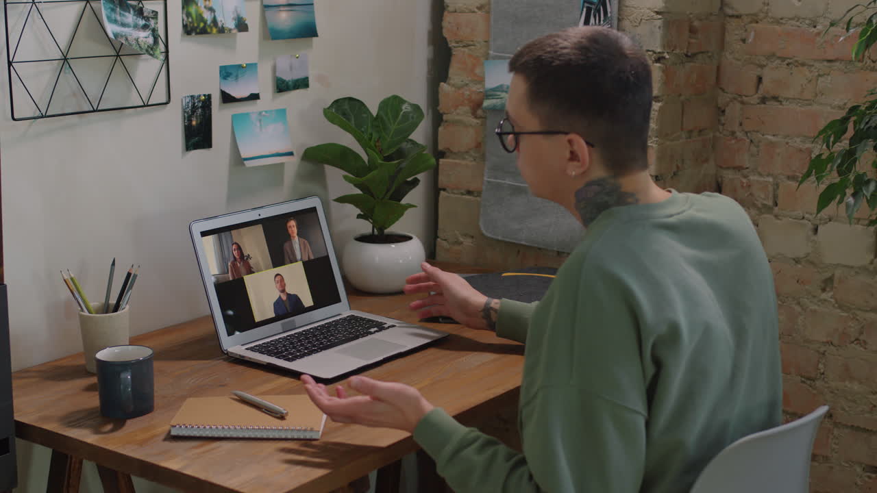 Man Having Video Conference With Colleagues