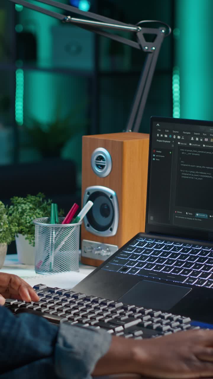 Vertical video Freelancing admin in home office using laptop to write programming language code