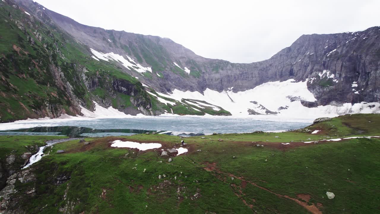 Stunning Aerial View of a Glacial Lake Nestled in the Mountains