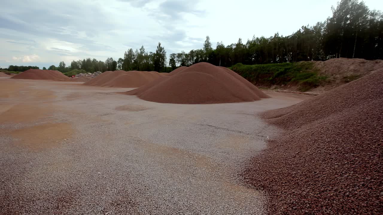 A storage facility for various types and sizes of pebbles and sand