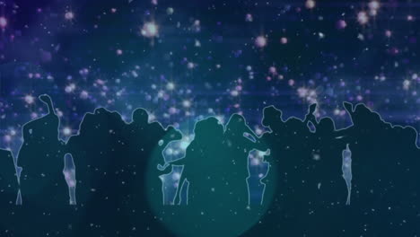 silhouetted crowd against starry night sky with glowing lights animation